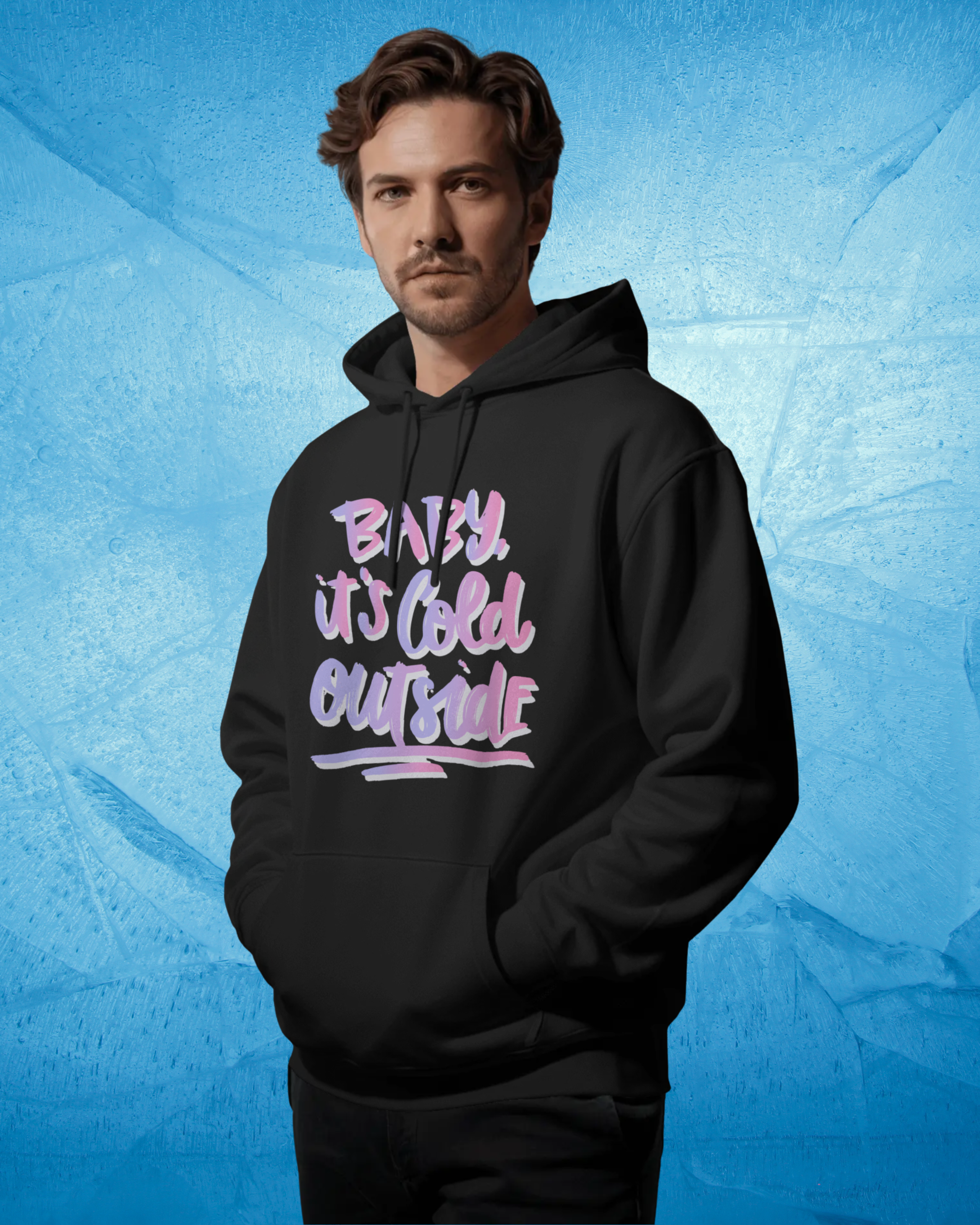 Man wearing a black hoodie with colorful text on a blue textured background