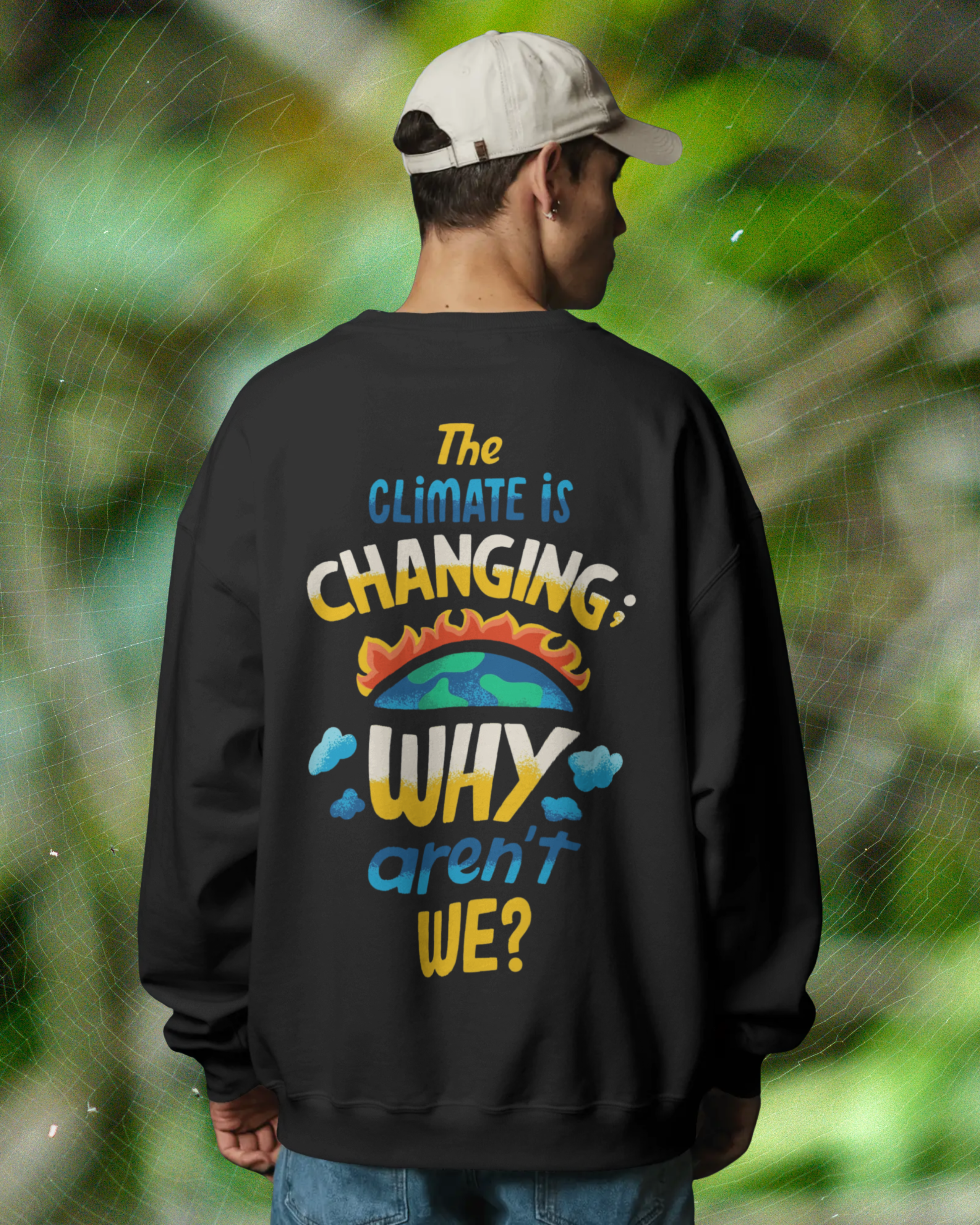 Person wearing a black sweatshirt with climate change message outdoors