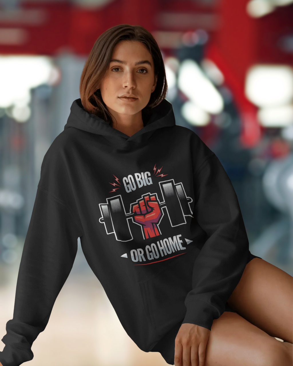 Person wearing a black hoodie with a motivational graphic and text