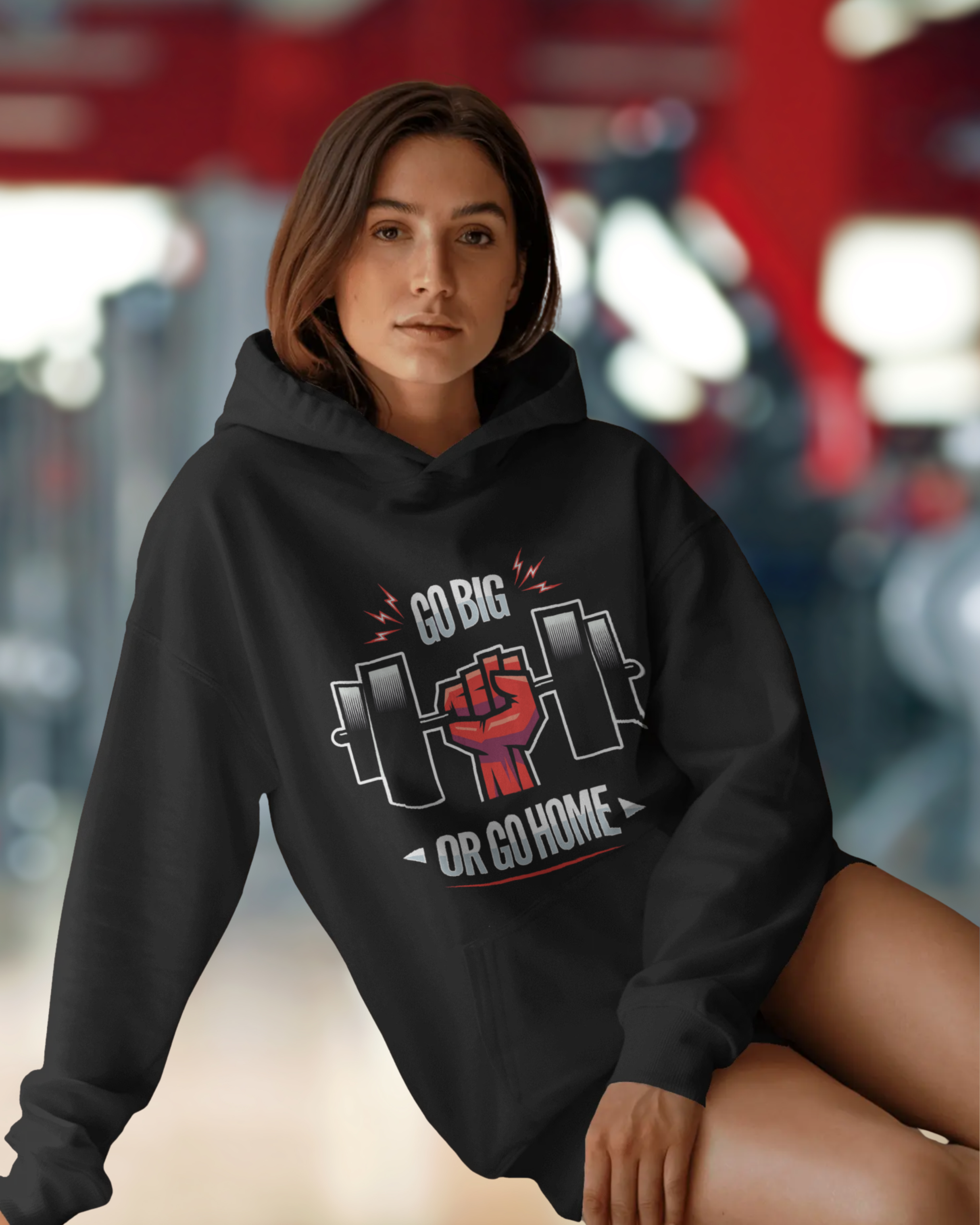 Person wearing a black hoodie with a motivational graphic and text