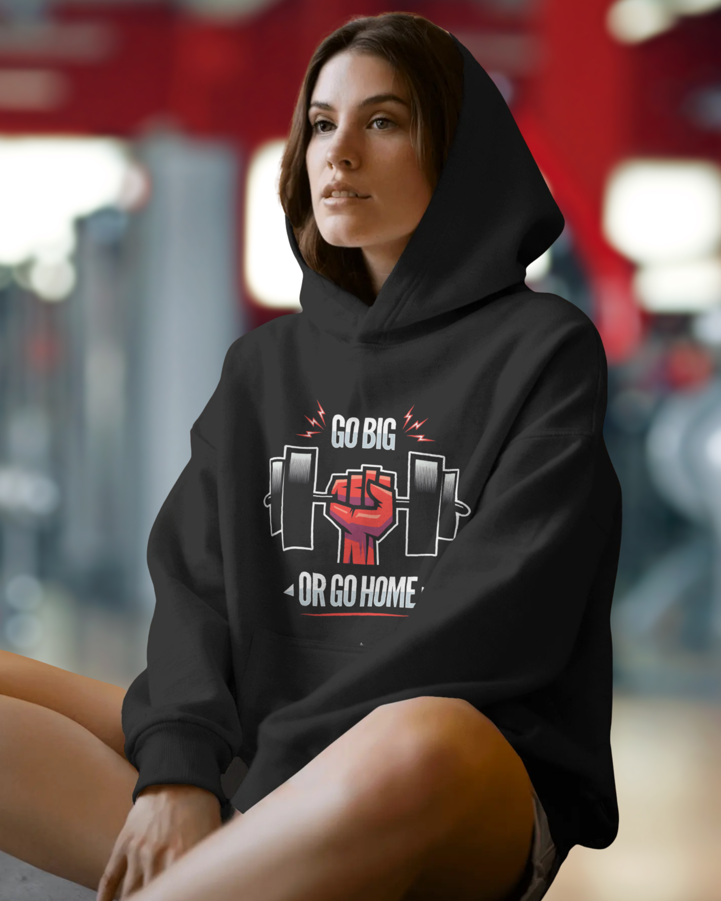 Person wearing a black hoodie with a motivational graphic and text