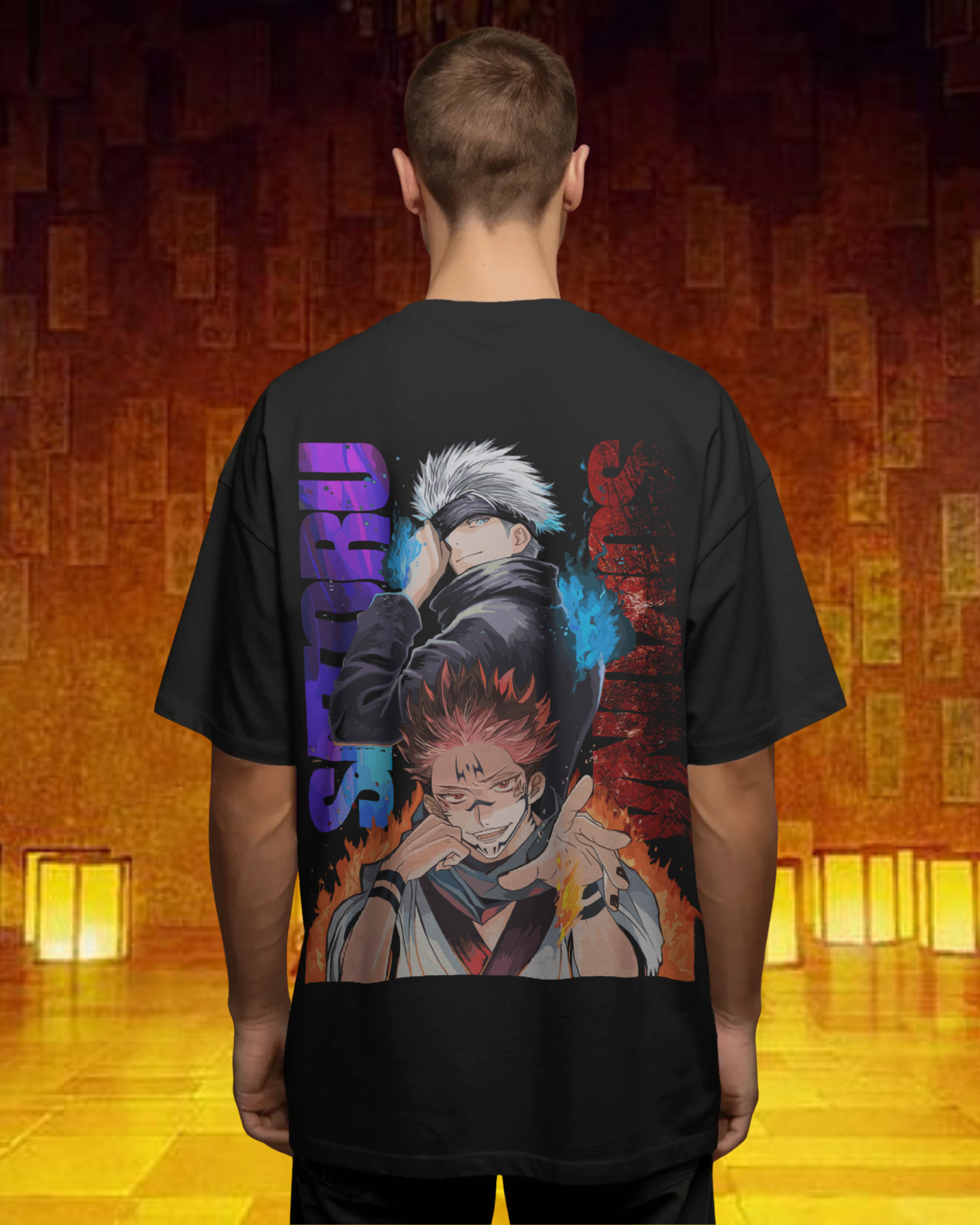 Person wearing a black t-shirt with a graphic design on the back, standing in a room with wooden floors and lanterns