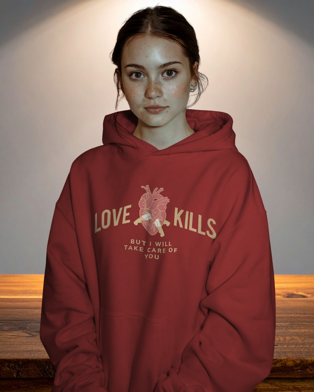 Person wearing a red hoodie with text and graphic design