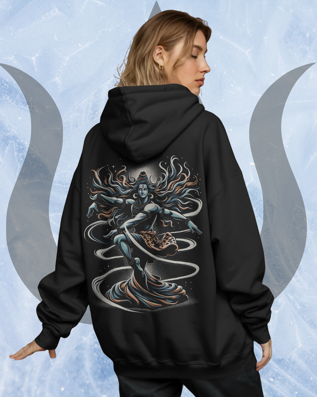 Person wearing a black hoodie with a detailed design on the back against a light blue background with moon symbols
