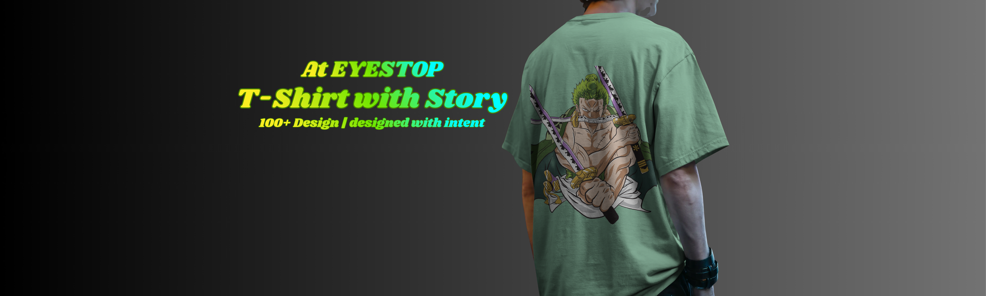 Person wearing a green t-shirt with a graphic design on the back, standing against a gray background