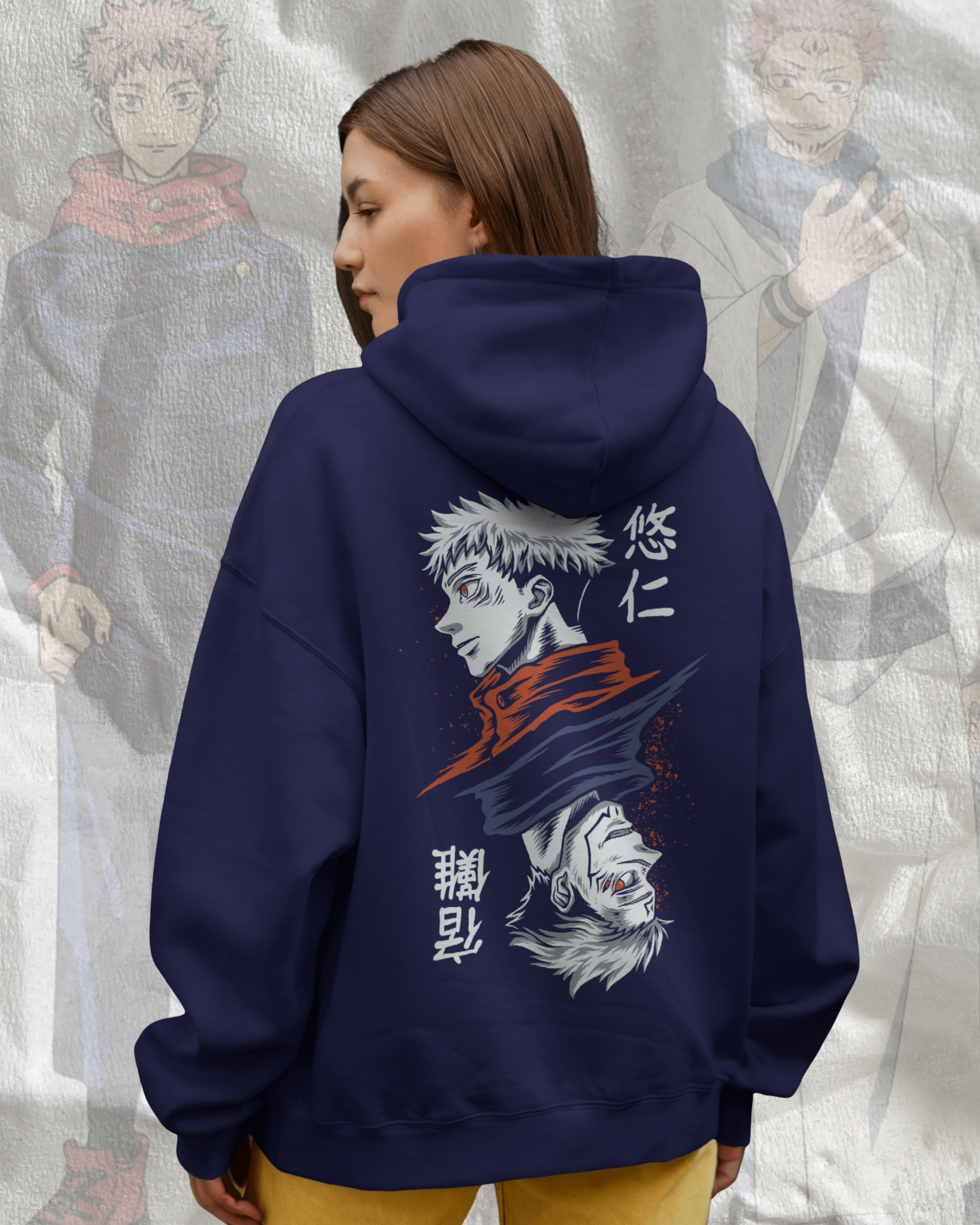 Person wearing a navy hoodie with anime character design and text, standing against a light gray textured background